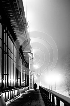 Night industrial landscape, a building with large windows, a city