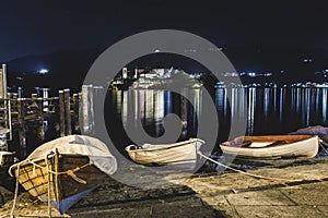 Night lake with boats. Lake Orta at Orta San Giulio, northern Italy