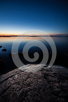 Night lake landscape and rock