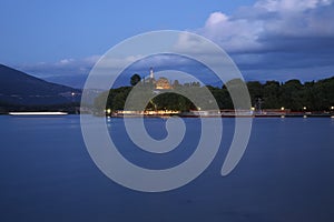 Night at lake with light over the cost