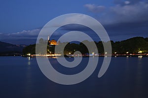 Night at lake with light over the cost