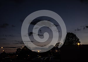 Night landscape, against the background of the city and trees at sunset. Nature.