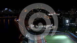 Night landscape , bird 's - eye view . Stock footage .A view of the city in the dark, where you can see a football