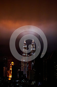 The night landscape of downtown Kuala Lumpur. View of the famous petronas oil company towers. The lighting of the buildings