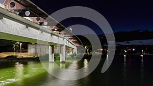 Night landscape of an illuminated bridge over a river