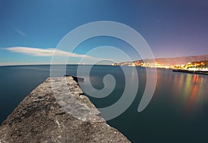 Night landscape with the lights of city and sea