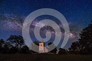 Night landscape, milky way over small church