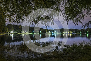 Night landscape in park with pond