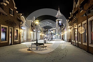 Night landscape of winter street with tower clock