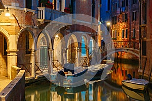 Night lateral canal and bridge in Venice, Italy