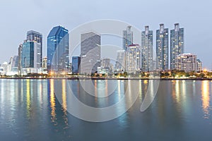 Night light Office building city downtown with water reflection