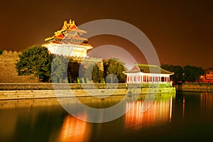 Night lighting corner towers of the Forbidden City. Beijing, China.