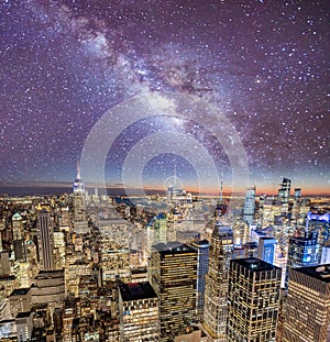 Night lights of Midtown Manhattan skyscrapers. Sunset aerial view of New York City buildings and skyline