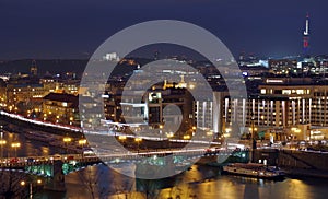 Night lights in Prague. Landmark attraction: Vltava River, Svatopluk Cech Bridge - Cechuv most - Czech Republic