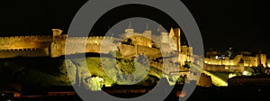 Night lights on the ramparts and castle towers of medieval Carcassonne