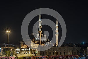 Night and long exposure image of the new Muslim Eminonu Mosque in the Golden Horn of Istanbul with the metro passing underneath