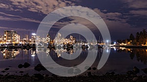 A night long exposure photo of marina inside Burrard Inlet of Vancouver Harbor