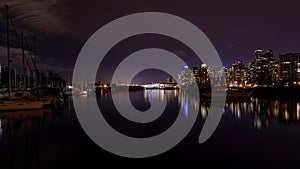 A night long exposure photo of marina of Vancouver Harbor