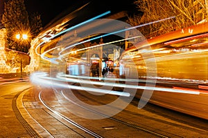 Night long exposure shot of two trams near the Mercado Central in Zaragoza, Spain