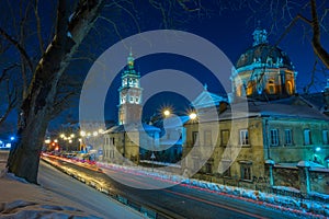 Night Lviv old city architecture in the winter season. Buildings highlighted by the illumination