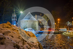 Night Lviv old city architecture in the winter season. Buildings highlighted by the illumination