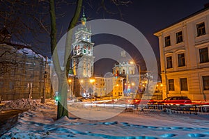 Night Lviv old city architecture in the winter season. Buildings highlighted by the illumination