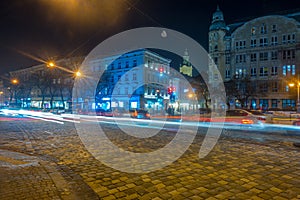 Night Lviv old city architecture in the winter season. Buildings highlighted by the illumination