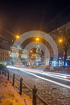 Night Lviv old city architecture in the winter season. Buildings highlighted by the illumination