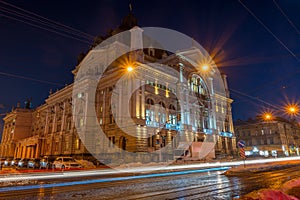 Night Lviv old city architecture in the winter season. Buildings highlighted by the illumination