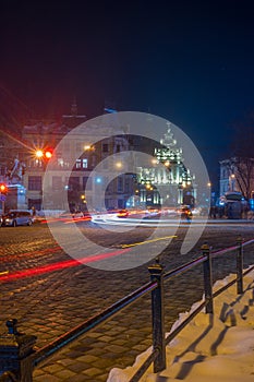 Night Lviv old city architecture in the winter season. Buildings highlighted by the illumination