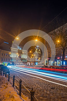 Night Lviv old city architecture in the winter season. Buildings highlighted by the illumination