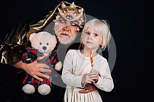 Night monster with child. little girl child near man night monster holding bear. childhood and imagination. nightmare