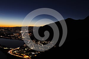 Night panorama from the Alps over northern Lombardy with city lights pollution