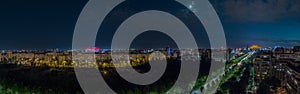 Night panorama of Bucharest wit huge building of parliament in the centre. Romania capital on summer night. Evening view over the