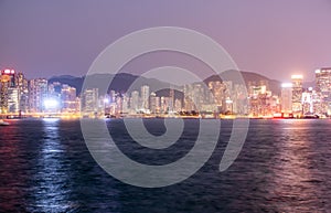 Night panorama of the evening city of Hong Kong with skyscrapers.