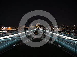 Night panorama of historic Millennium bridge over Thames river at St Pauls Cathedral London England Great Britain GB UK