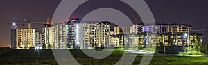 Night panorama of new built and still under construction apartment buildings