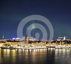 Night panorama with northern lights of Gamla Stan, Stockholm , Sweden