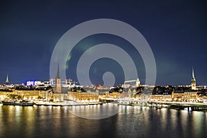 Night panorama with northern lights of Gamla Stan, Stockholm , Sweden