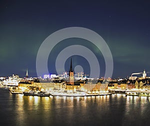 Night panorama with northern lights of Gamla Stan, Stockholm , Sweden