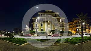 Night panorama of Piazza Anco Marzio located in the pedestrian area and the center of the night life in Ostia Lido a beachfront