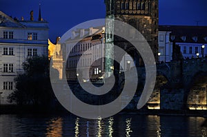 Charles bridge over the Vltava in the moonlight. Prague, a warm summer night.