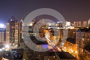 Night panoramic aerial winter cityscape view of Voronezh city, houses, night lights