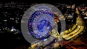 Night panoramic landscape of illuminated ferris wheel at Rio de Janeiro Brazil