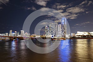 Night panoramic photo of Miami landscape. Bayside Marketplace Miami Downtown behind MacArthur Causeway from Venetian
