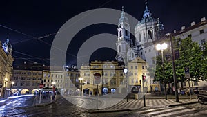 Night view of the illuminated malostranske namesti square timelapse hyperlapse in prague photo
