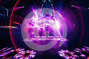Night party rave concert stage with pink lasers photo