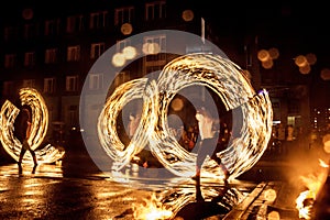 Night performance fire show in front of a crowd of people