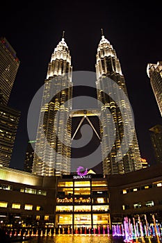 Night Petronas towers and Suria shopping mall, Kuala Lumpur