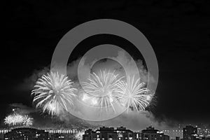 Night photo black and white on New Year's (RÃ©veillon) with fireworks in the sky